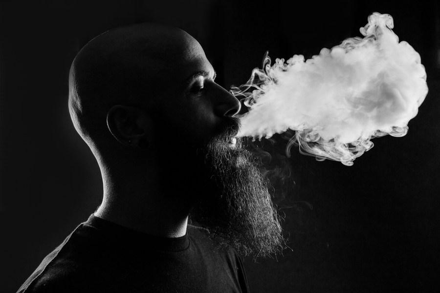 A man vaping in black and white - What are refillable disposable vapes? - Haypp UK